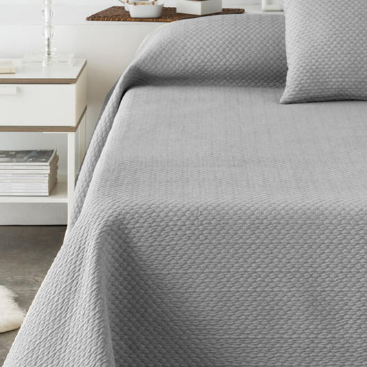Colcha gris lisa jacquard: Comodidad, durabilidad y estilo para tu dormitorio.