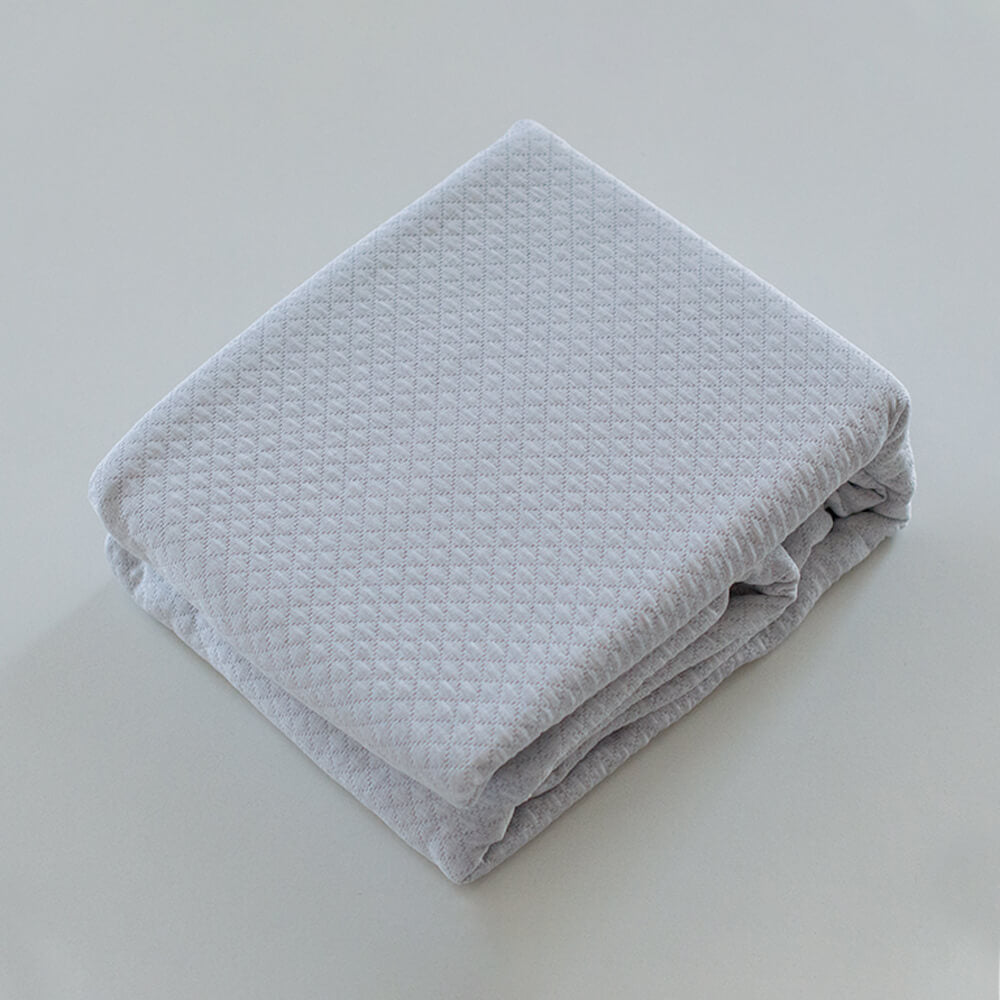 Colcha gris lisa jacquard: Comodidad, durabilidad y estilo para tu dormitorio.