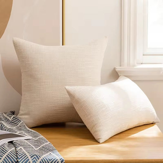 Plain off-white cushion cover with relief.