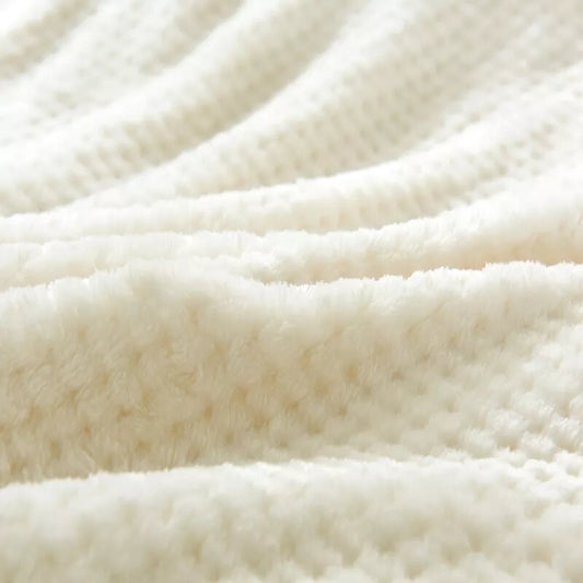 Manta polar blanco roto.