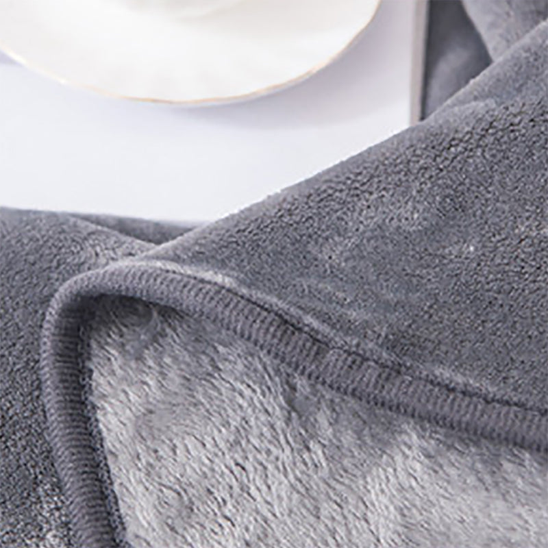 Manta polar suave. Color gris.