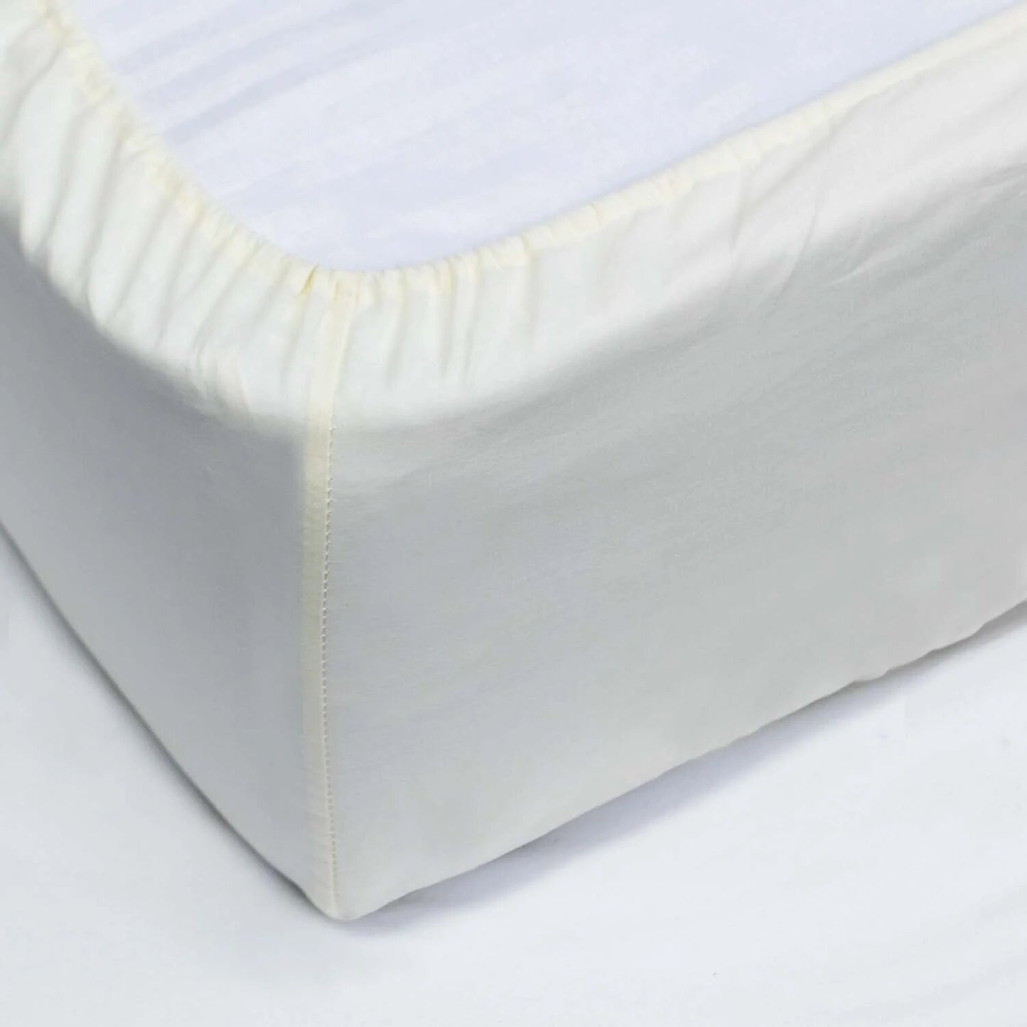 Bajera ajustable 100% Algodón Basic. Sábana bajera Lisa Crema - Blanco roto.