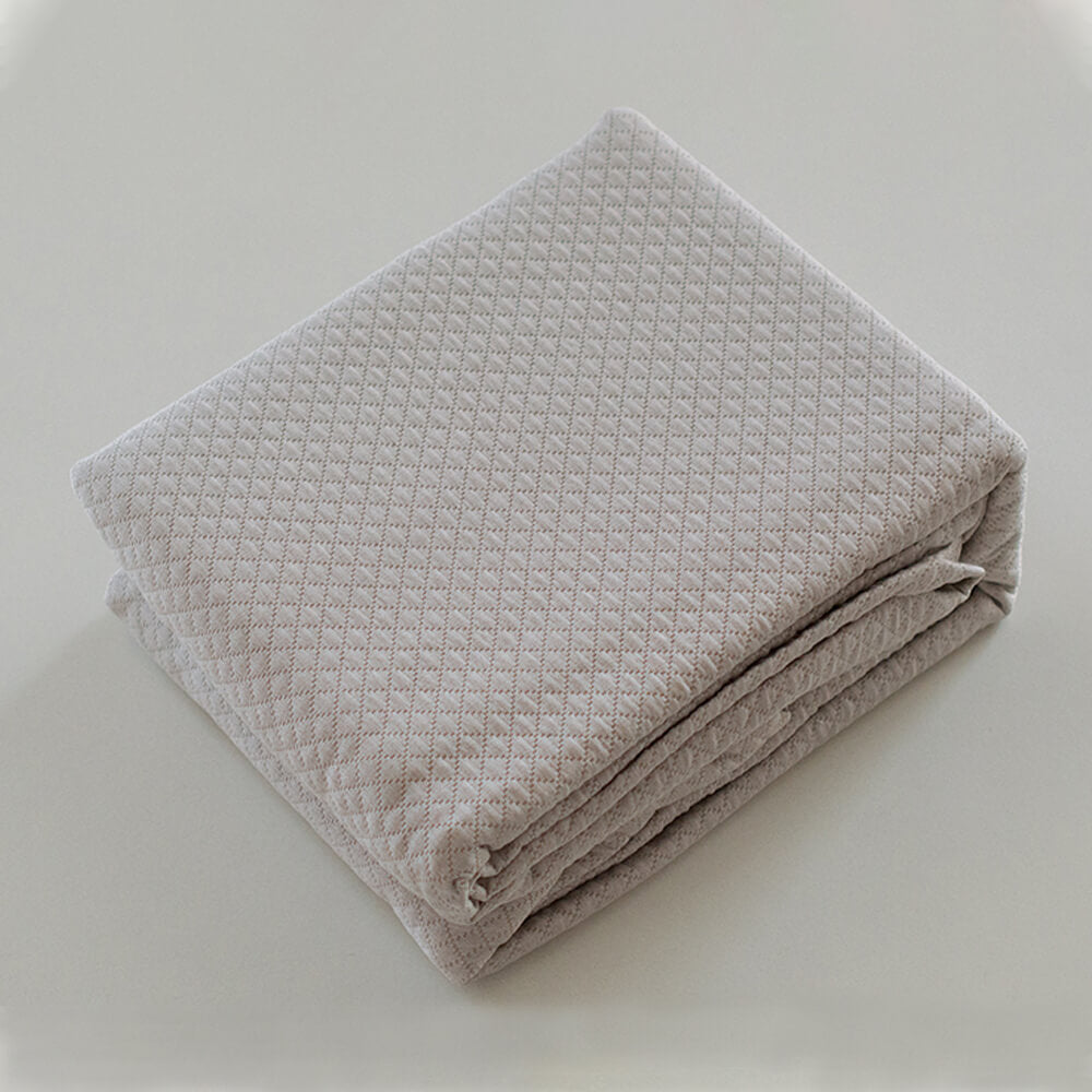 Colcha beige lisa jacquard: Comodidad, durabilidad y estilo para tu dormitorio.