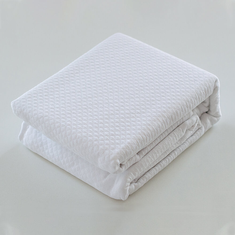 Colcha blanca lisa jacquard: Comodidad, durabilidad y estilo para tu dormitorio.