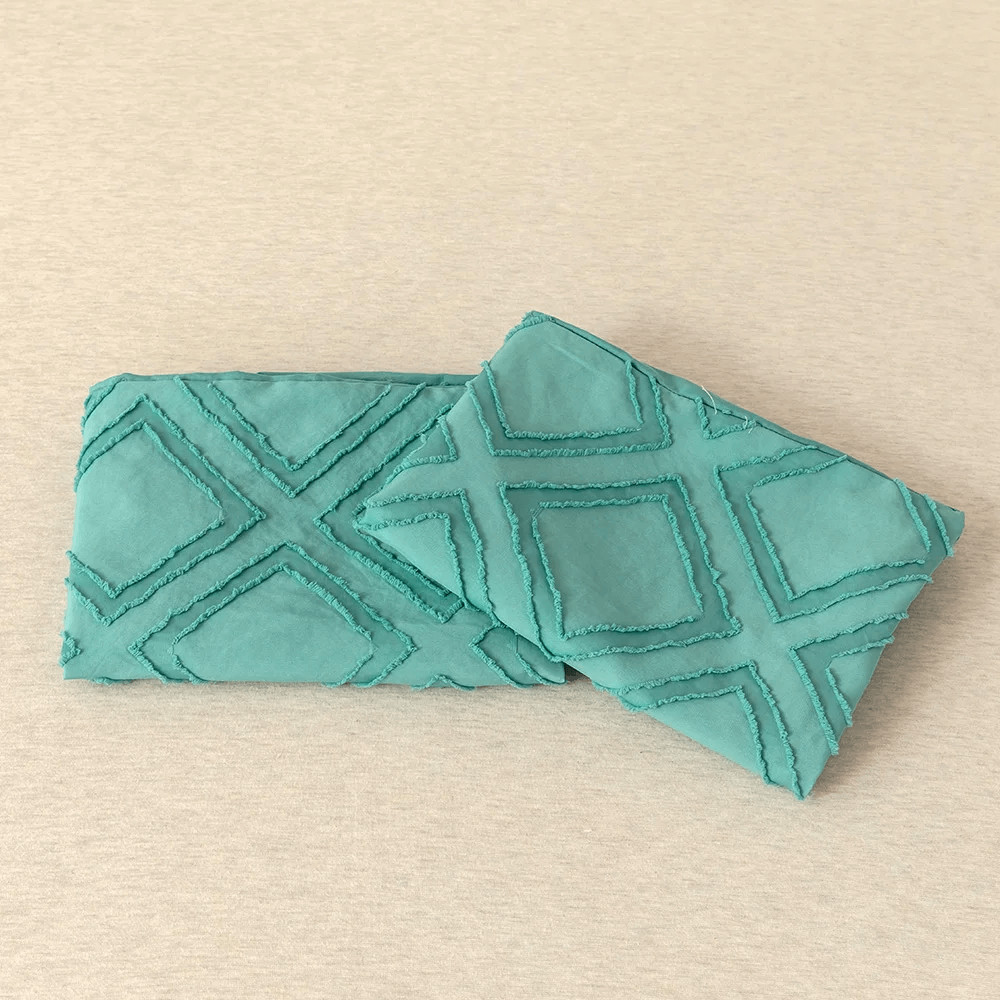 Turquoise duvet cover with embossed rhombuses, modern and extra soft.