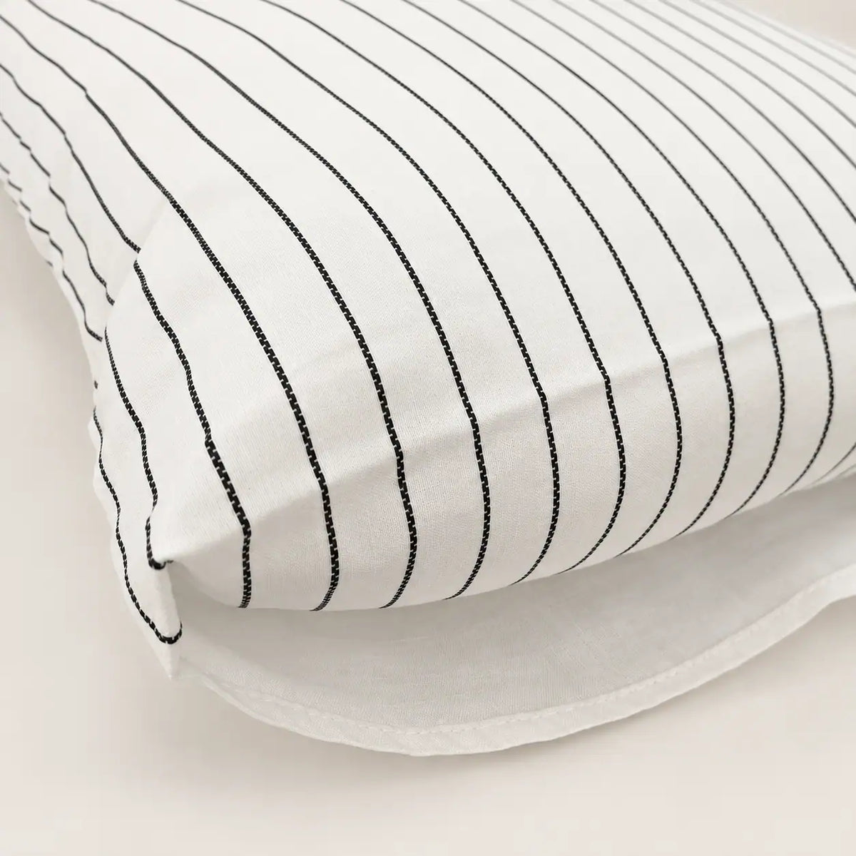 Detail of the pillowcase with an envelope-style flap closure that keeps the pillow covered.