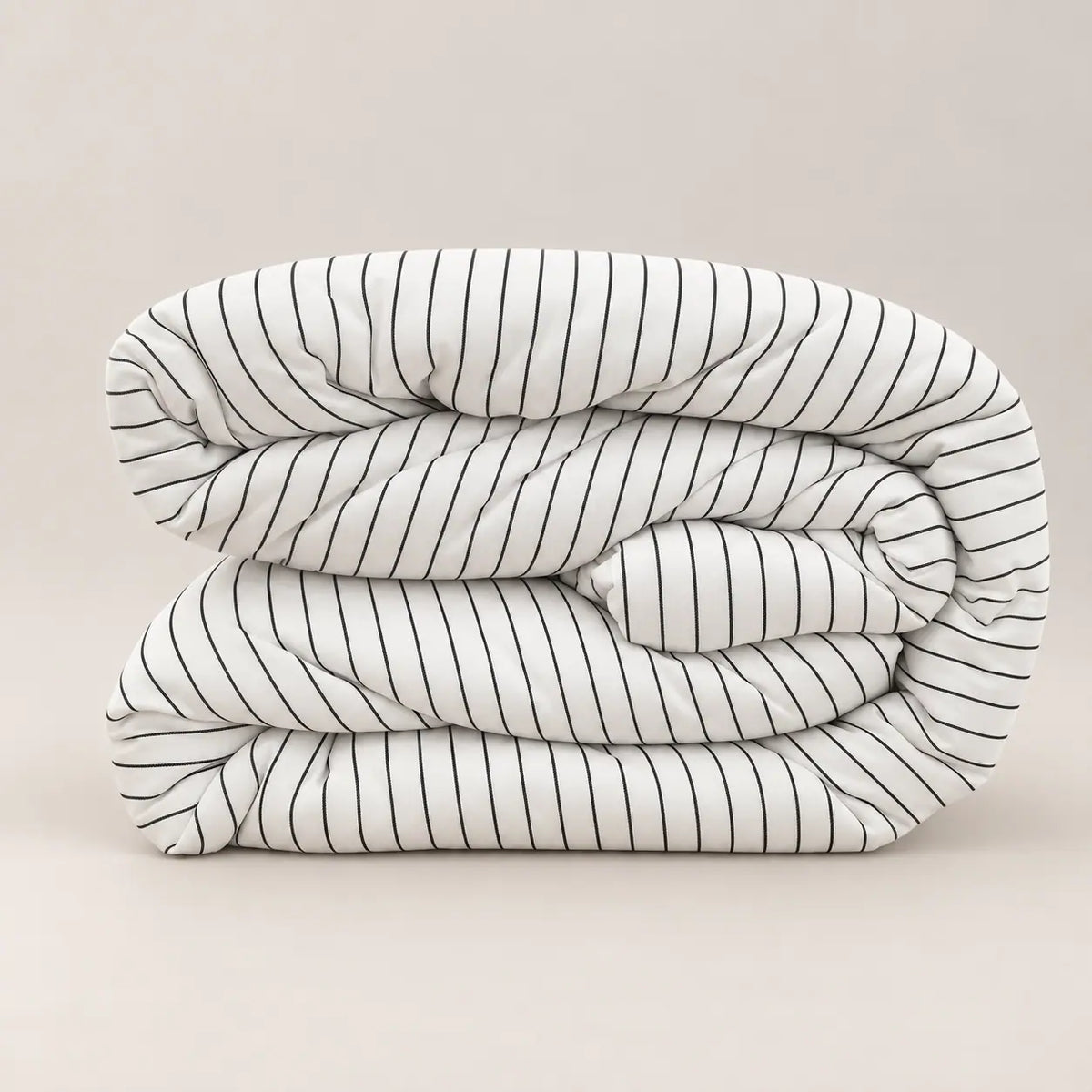 Side view of the premium duvet, highlighting its 250gsm filling and the subtle contrast between the fine-striped side and plain white reverse.